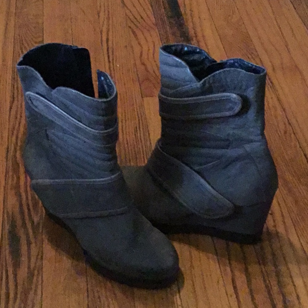 Taupe wedged boots.